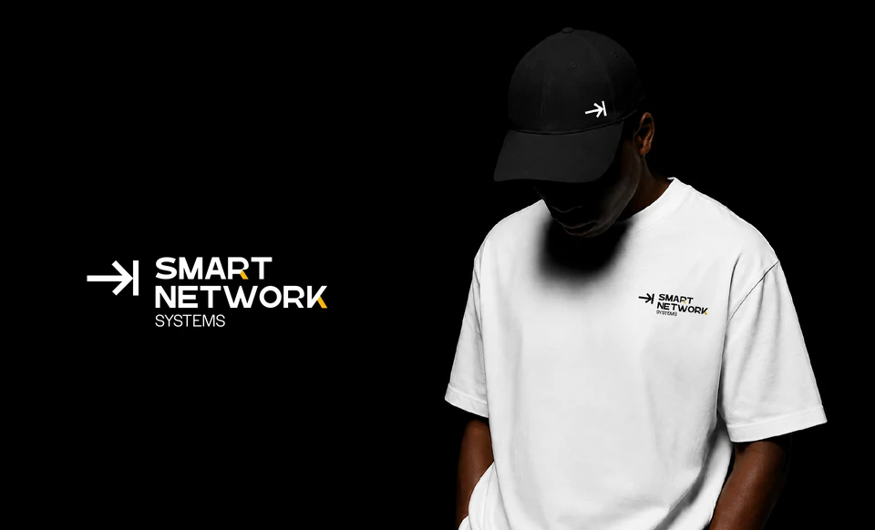 Smart Network Systems identity applied to a white T-shirt and black cap against a black background